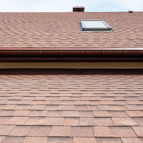 Roofing construction and building new house with modular chimney, skylights, attic, dormers and eaves